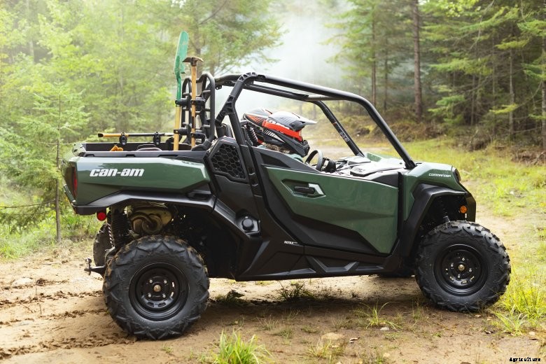 Green Can-Am Commander DPS in the woods